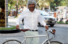 A doctor on a health awareness mission on his bicycle